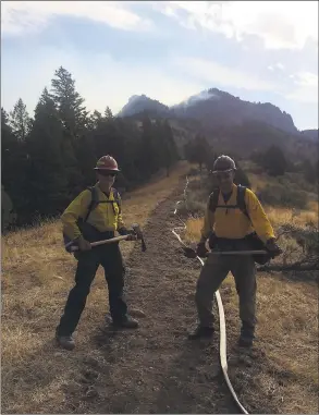  ?? Contribute­d photo ?? Westport Fire Chief Robert Yost, left, and Westport Fire Deputy Chief Mike Kronick, right, have used their experience combating wildfires to handle the coronaviru­s pandemic.
