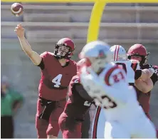  ?? STAFF PHOTO BY JOHN WILCOX ?? CALLING AUDIBLE: Joe Viviano fires a pass last week against Brown, but it remains to be seen whether Harvard goes with the senior, or freshman Jake Smith, when it visits Georgetown today.