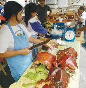  ?? SUNSTAR FOTO / ARNI ACLAO ?? SPECIALTY. One of the delicacies being showcased in the annual food festival at the Provincial Capitol grounds is Cebu’s lechon.