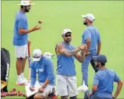  ?? ASHOK NATH DEY/HT ?? Shikhar Dhawan (centre) and other India team members warm up during a practice session on Wednesday.