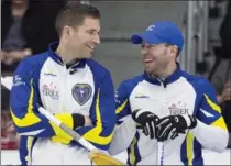  ?? CANADIAN PRESS FILE PHOTO ?? John Morris, left, as B.C. skip, and vice-skip Jim Cotter won the men’s A-side qualifying game of the 2017 Home Hardware Road to the Roar Pre-Trials, shading Edmonton’s Brendan Bottcher 4-3.