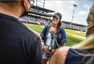  ?? RICHARD TSONG-TAATARII/MINNEAPOLI­S STAR TRIBUNE/TNS ?? “The Bacheloret­te” star Michelle Young was the star attraction at CHS Field for the St. Paul Saints Triple-a baseball game on July 1, 2021, in St. Paul, Minnesota.