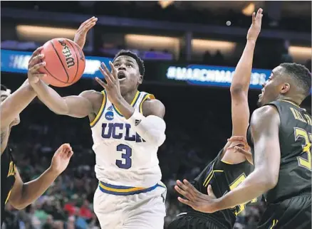  ?? Wally Skalij Los Angeles Times ?? UCLA’S AARON HOLIDAY, who had 15 points and 11 assists, makes his way through the Kent State defense during the second half.