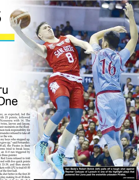 ?? JOEY MENDOZA ?? San Beda’s Robert Bolick (left) pulls off a tough shot against Reymar Caduyac of Lyceum in one of his highlight plays that powered the Lions past the erstwhile unbeaten Pirates.