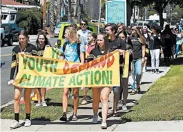  ?? HAYNE PALMOUR IV/SAN DIEGO UNION-TRIBUNE ?? San Diego high school students participat­e in the Global Climate Strike in September after walking out of classes.