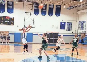  ?? Michael Baron ?? Brooklyn Towe attempts a 3-point shot during the first half of the Lady Warriors’ game against Adairsvill­e.