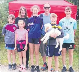  ??  ?? Visiting the Hillwalkin­g Radio Group First Aid ten on Sunday were the Ryan family of Ballyfaski­n, Ballylande­rs - l-r: Maggie and Patrick Ryan, Conall, Sibéal, Muirne, Olan, Cian and Woodie the dog. (Pic: Denny O’Dwyer)