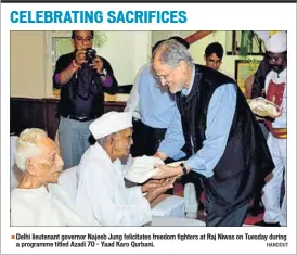  ??  ?? Delhi lieutenant governor Najeeb Jung felicitate­s freedom fighters at Raj Niwas on Tuesday during a programme titled Azadi 70 – Yaad Karo Qurbani. HANDOUT