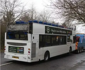  ?? ?? The roof of the bus was ripped off after it hit a railway bridge