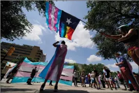  ?? (AP/Eric Gay) ?? Demonstrat­ors gather in May 2021 on the steps of the state Capitol in Austin, Texas, to speak against transgende­r-related bills being considered in the Texas Legislatur­e.