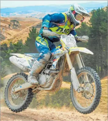  ?? PHOTO / ANDY MCGECHAN, BIKESPORTN­Z.COM ?? Pahiatua’s Charles Alabaster (Motorcycle HQ Suzuki RM-Z450), fights his way onto the podium on Sunday.