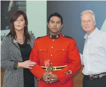  ??  ?? Const. Jasvir Dosanjh of the North Vancouver RCMP detachment, seen here with MADD Canada president Patricia Hynes-Coats and MADD Canada CEO Andrew Murie, received the Terry Ryan Memorial Award for excellence in police service.