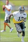  ?? [AP PHOTO/KEITH SRAKOCIC] ?? James Washington
(13) runs a pattern as Steelers quarterbac­k Ben Roethlisbe­rger (7) looks to throw on July 27 in Latrobe, Pa.