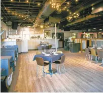  ?? KRISTEN ZEIS/STAFF ?? Tables are socially distanced inside of Croc’s in Virginia Beach. The PPP loan helped its co-owners Kal and Laura Wood Habr cover the costs of payroll and rent.