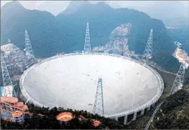  ?? CHINATOPIX ?? The Five-hundred-meter Aperture Spherical Telescope in China went online Sunday.