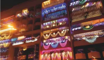  ?? Virendra Saklani/Gulf News ?? ■
Decorative lights adorn buildings in Bur Dubai yesterday for Diwali celebratio­ns.