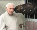  ??  ?? The late Tommy Whelan with one of his horses.