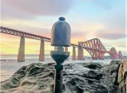  ?? NBLS/OWEN CUNNINGHAM ?? Bridge and whistle: The Highland Railway whistle for Ben Alder, pictured at the Forth Bridge. The group building the replica hopes the locomotive will cross the bridge one day.