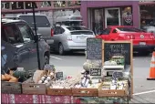  ?? NORTH COAST GROWERS ASSOCIATIO­N – CONTRIBUTE­D ?? Pictured is the Sarvinski Family Farms booth at the farmers market on the Arcata Plaza.