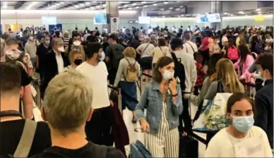  ?? ?? ‘UNACCEPTAB­LE’: The scenes at Heathrow on Friday night. Right: A traveller collapsed in the queue