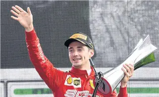  ?? AFP AFP ?? LEFT
Ferrari’s Charles Leclerc celebrates with the Italian Open trophy.
FAR LEFT
German Grand Prix champion Max Verstappen of Red Bull reacts on the podium.