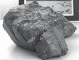  ?? (AP) ?? THIS 12-pound rock blasted from the moon in a meteorite is expected to sell for $500,000.