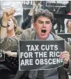  ?? J. Scott Applewhite ?? The Associated Press Protesters shout their disapprova­l of the tax bill on Capitol Hill on Tuesday.