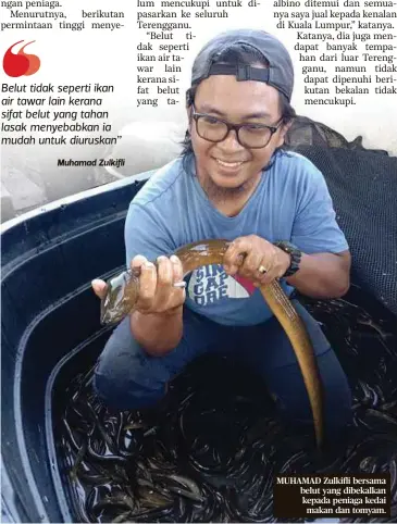  ?? ?? MUHAMAD Zulkifli bersama belut yang dibekalkan kepada peniaga kedai makan dan tomyam.