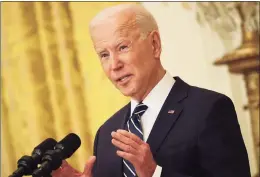  ?? Chip Somodevill­a / TNS ?? U.S. President Joe Biden talks to reporters during the first news conference of his presidency in the East Room of the White House on Thursday.