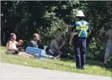  ?? JASON BAIN EXAMINER ?? Tina Knott sits with her two dogs and cat as firefighte­rs battled the June 11 blaze that destroyed her Parkhill Road home.