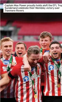  ??  ?? Captain Max Power proudly holds aloft the EFL Trop Sunderland celebrate their Wembley victory over Tranmere Rovers