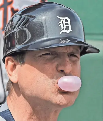  ?? CHRIS O’MEARA, AP ?? Michigan football coach Jim Harbaugh moonlighte­d as the Tigers first-base coach Wednesday.