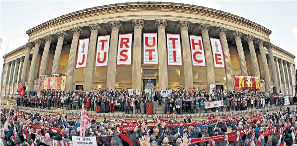  ??  ?? The crowd sing You’ll Never Walk Alone during a vigil in memory of Hillsborou­gh disaster victims last night at St George’s Hall in Liverpool. The truth and justice banner has the names inscribed of all 96 who lost their lives