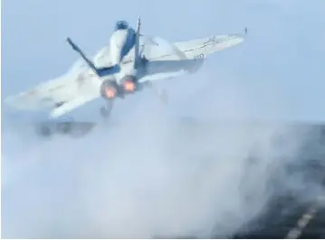  ?? ALBERTO PIZZOLI / AFP / GETTY IMAGES ?? The U.S. navy has temporaril­y grounded its Super Hornet fighter jet fleet after a pilot and an electronic warfare officer were taken to hospital on Friday after something went wrong with the canopy of their jet before takeoff.