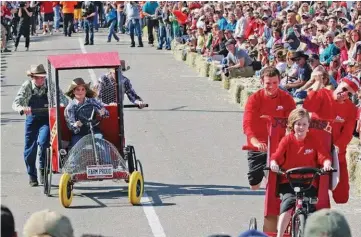  ?? ARKANSAS DEMOCRAT-GAZETTE FILE PHOTOS ?? LEFT: Cody Fuller of Emerson races down the track during the men’s modified finals of the World Championsh­ip Tiller Races during the 2018 Purple Hull Pea Festival in Emerson. Fuller won the race and the championsh­ip. RIGHT: Outhouse racers head toward the finish line at the 36th annual Arkansas Bean Fest and Championsh­ip Outhouse Races in Mountain View.