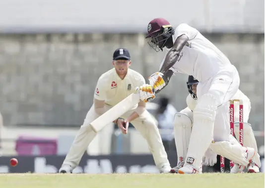  ?? AP ?? Windies captain Jason Holder plays a shot against England during Day Three of their first Test match at the Kensington Oval in Bridgetown, Barbados, earlier this year.