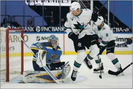  ?? JEFF ROBERSON — THE ASSOCIATED PRESS ?? The Sharks’ Timo Meier (28) watches as a puck sail past Blues goaltender Jordan Binnington (50) during the third period on Monday in St. Louis.