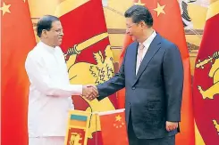  ??  ?? Sri Lankan President Maithripal­a Sirisena with Chinese President Xi Jinping