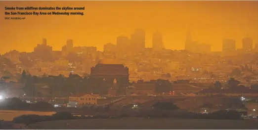  ?? ERIC RISBERG/AP ?? Smoke from wildfires dominates the skyline around the San Francisco Bay Area on Wednesday morning.