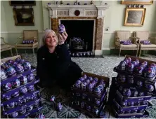  ??  ?? Claire Grant, of the National Trust for Scotland, with Easter eggs in the drawing room at the National Trust’s Georgian House in Edinburgh, as the trust bids to find homes for thousands of eggs