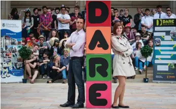  ??  ?? “My experience at Dare and ProtoPlay really helped me be vocal and open about showing my work to other people and listening to feedback and ideas,” says George, pictured here with SCEE academic developmen­t manager Luke Savage