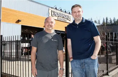  ?? CITIZEN PHOTO BY JAMES DOYLE ?? Co-owners Daryl Leiski and Bjorn Butow stand in front of CrossRoads Brewing on Friday afternoon. It was announced on Friday morning that CrossRoads would be putting on three festivals this summer.