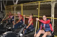  ?? MEDIANEWS GROUP FILE PHOTO ?? Local athletes wear their Team USA gear and medals they won at the world championsh­ip for dragon boating while posing for a photo on ergometers at the Pottstown Athletic Club.