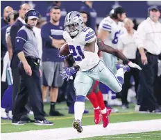  ?? — GETTY IMAGES ?? Dallas Cowboys running back Ezekiel Elliott bulldozed his way to a career-high 159 yards Sunday in Dallas’ 26-20 win over Tampa Bay.