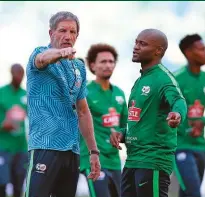  ??  ?? Above: Baxter chats to Bafana striker, Tokelo Rantie. Main pic: National team coach, Stuart Baxter, with his players during a Bafana Bafana training Session.