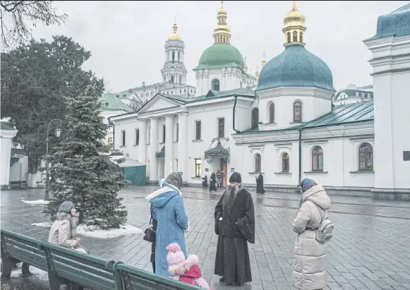  ?? PHOTOS: LAURA BOUSHNAK/NYT ?? Praying at the St Michael’s Golden Domed Monastery, the seat of the Ukrainian church.
Outside the Monastery of the Caves complex in Kyiv.