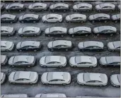  ?? ASSOCIATED PRESS ARCHIVES ?? Hundreds of Chevrolet Cruze cars sit in a parking lot at General Motors’ assembly plant in Lordstown, Ohio. Nearby long-struggling Youngstown wants to become a research and production hub for electric vehicles.