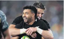  ?? PHOTO: GETTY IMAGES ?? Double trouble . . . All Black first fiveeighth Richie Mo’unga (front) is congratula­ted by fullback Beauden Barrett after the No 10 scored his second try in the Bledisloe Cup test against Australia in Sydney on Saturday night.