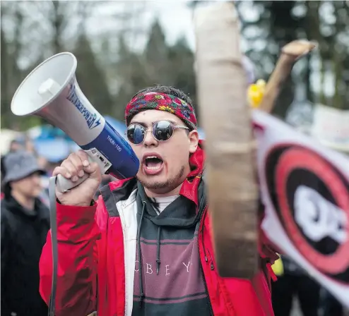  ?? DARRYL DYCK / THE CANADIAN PRESS FILES ?? Cedar George-Parker leads a protest this spring for those opposed to the Trans Mountain pipeline expansion. George-Parker vows to continue the fight to stop the project, which was bought by the federal government.