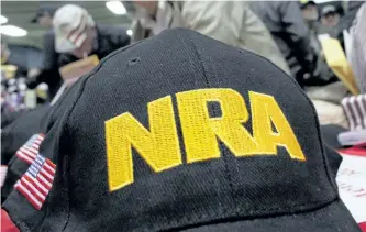  ?? THE ASSOCIATED PRESS FILES ?? U.S. companies are taking a closer look at investment­s, co-branding deals and other ties to the gun industry and its public face, the National Rifle Associatio­n, after the school shooting in Parkland, Fla., that left 17 people dead.
